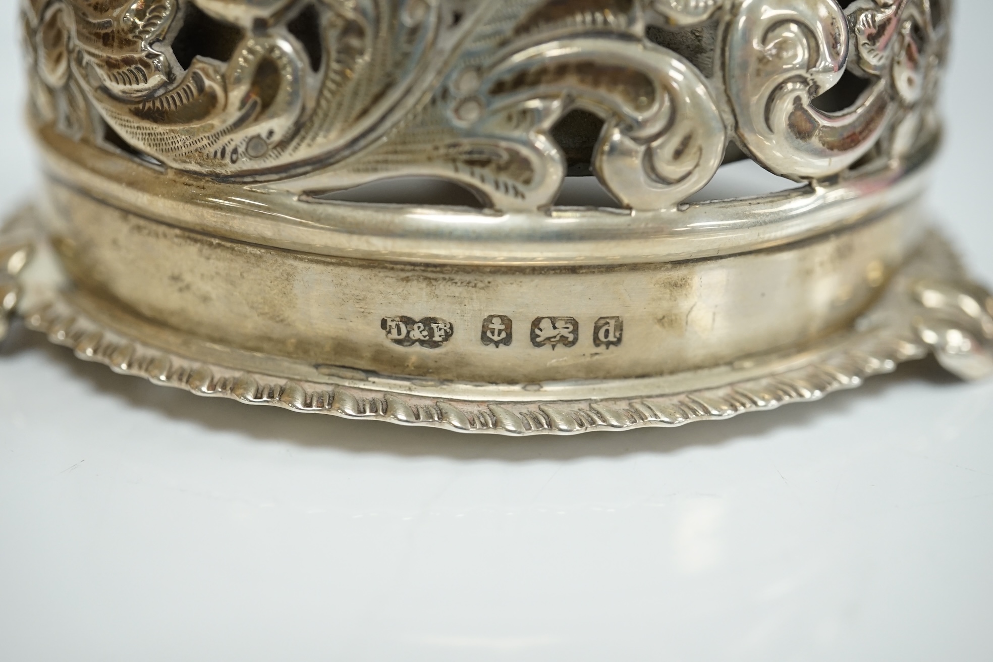 An Edwardian pierced silver table bell, by Deakin & Francis, Birmingham, 1903, diameter 82mm. Condition - poor